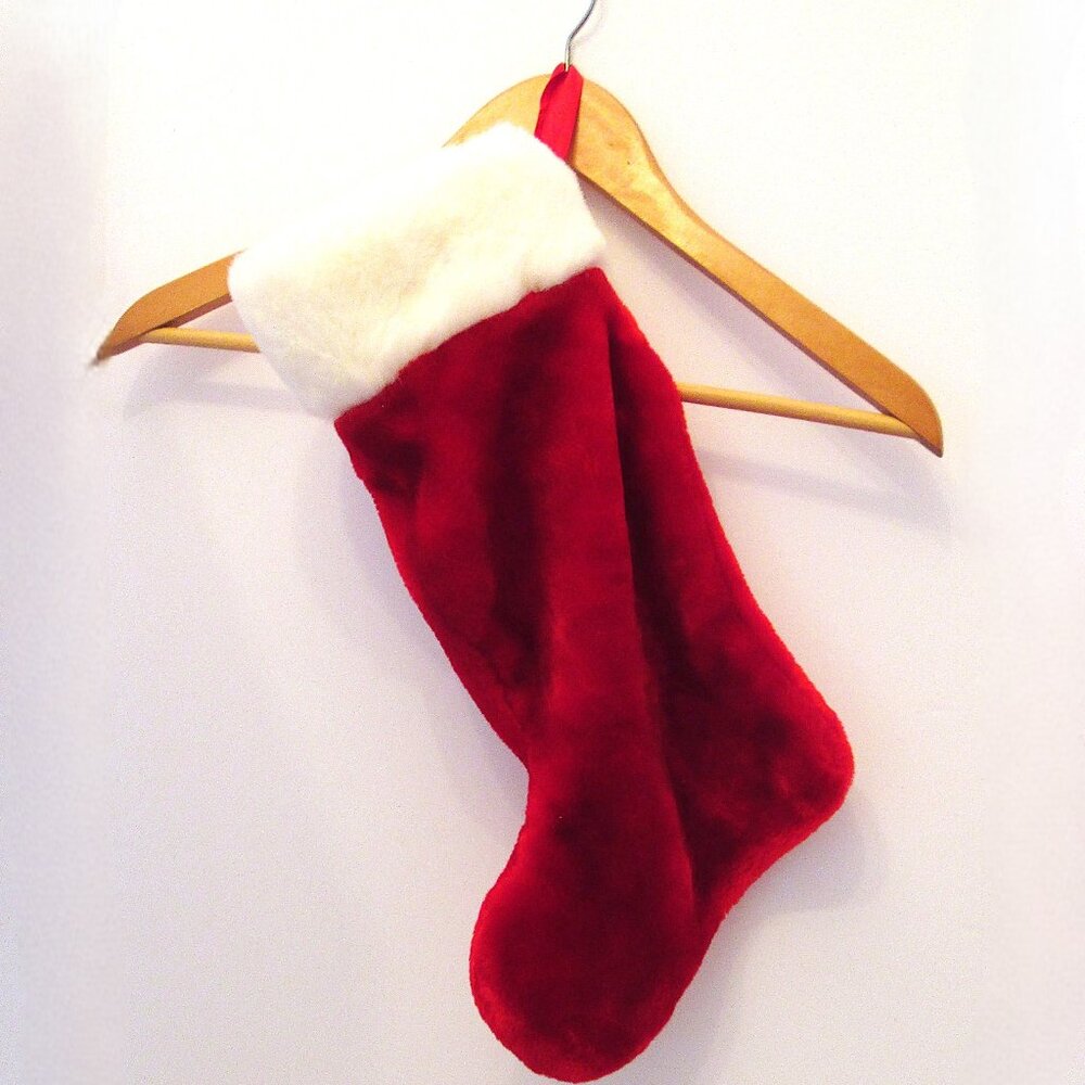 Red plushy with broad white furry band Christmas stocking for your fireplace